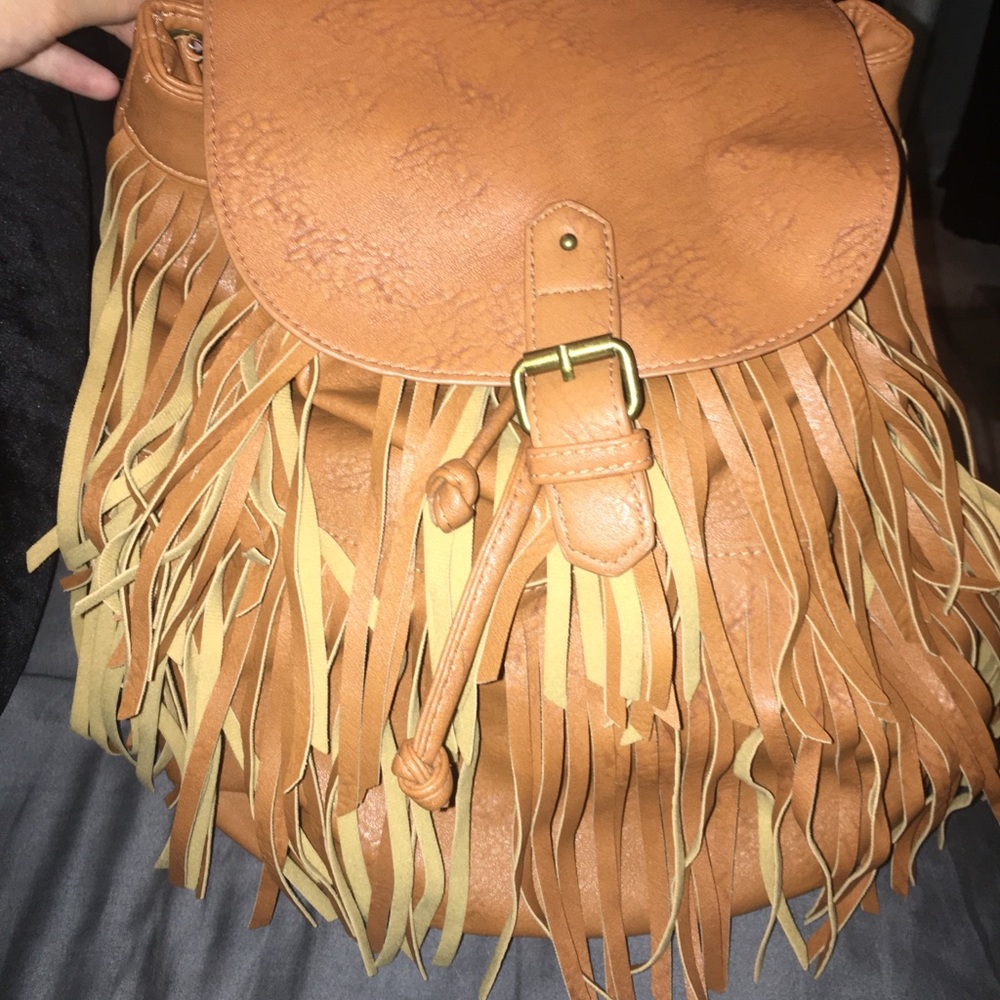 Tan leather fringe backpack